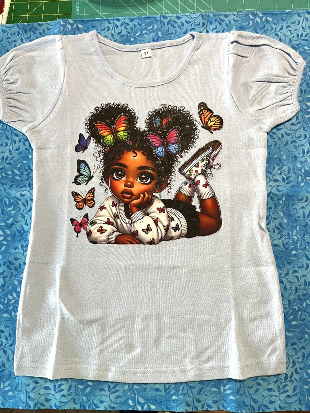 Girls HTV vinyl Beautiful Puff Sleeve Top with little girl and butterfly's.Size8